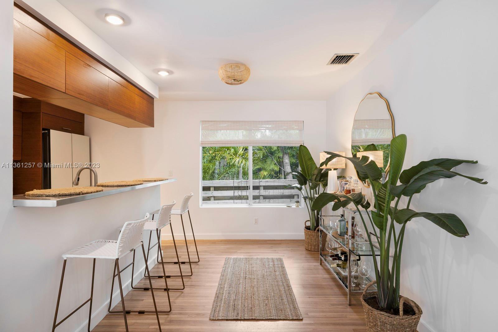 3894 Main Highway Coconut Grove, FL 33133 - Photo 9 of 28 a view of a livingroom with furniture and a window