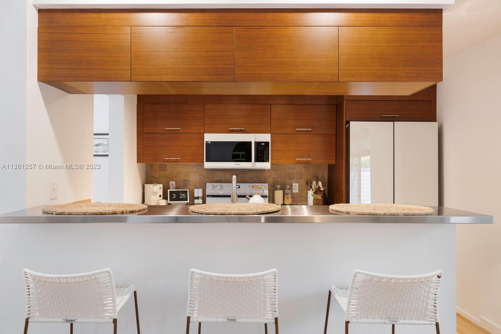 3894 Main Highway Coconut Grove, FL 33133 - Photo 10 of 28 a bathroom with a sink and a mirror