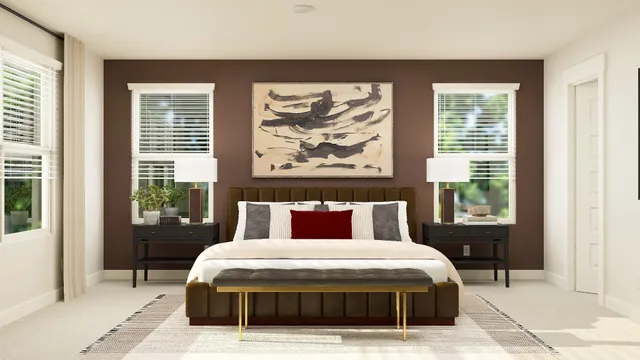 a bedroom with a large bed and a window