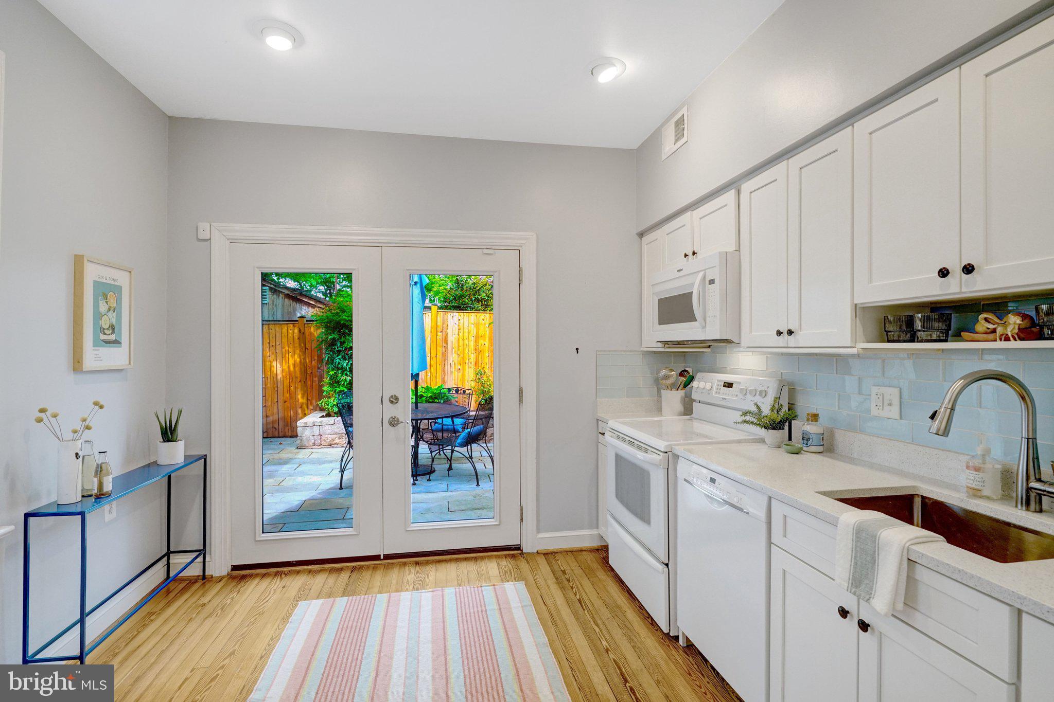 707 10th Street Southeast Washington, DC 20003 - Photo 15 of 46 Big BRIGHT kitchen w/wall of glass + a side window