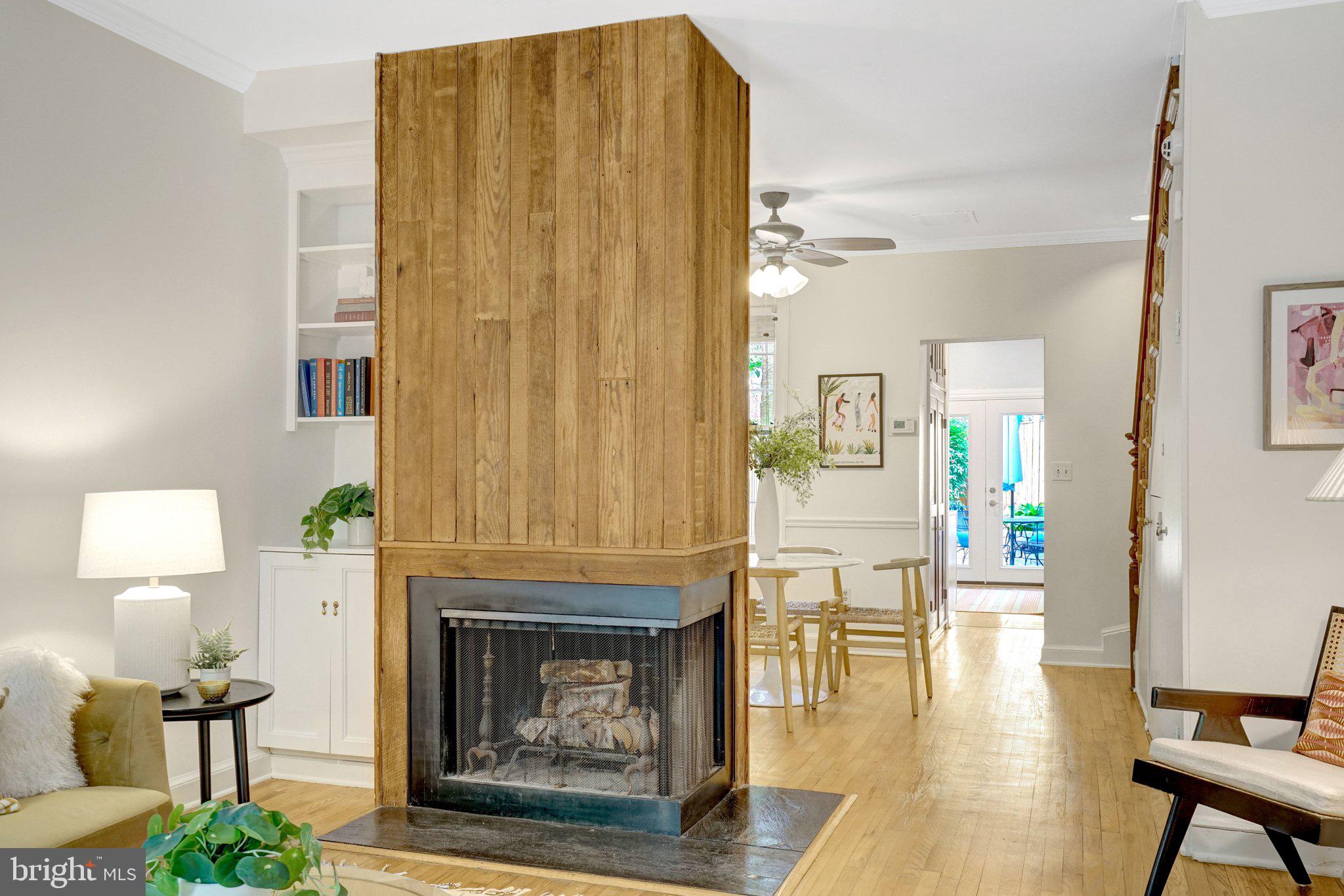 707 10th Street Southeast Washington, DC 20003 - Photo 8 of 46 Built-in bookcase and cabinet next to fireplace