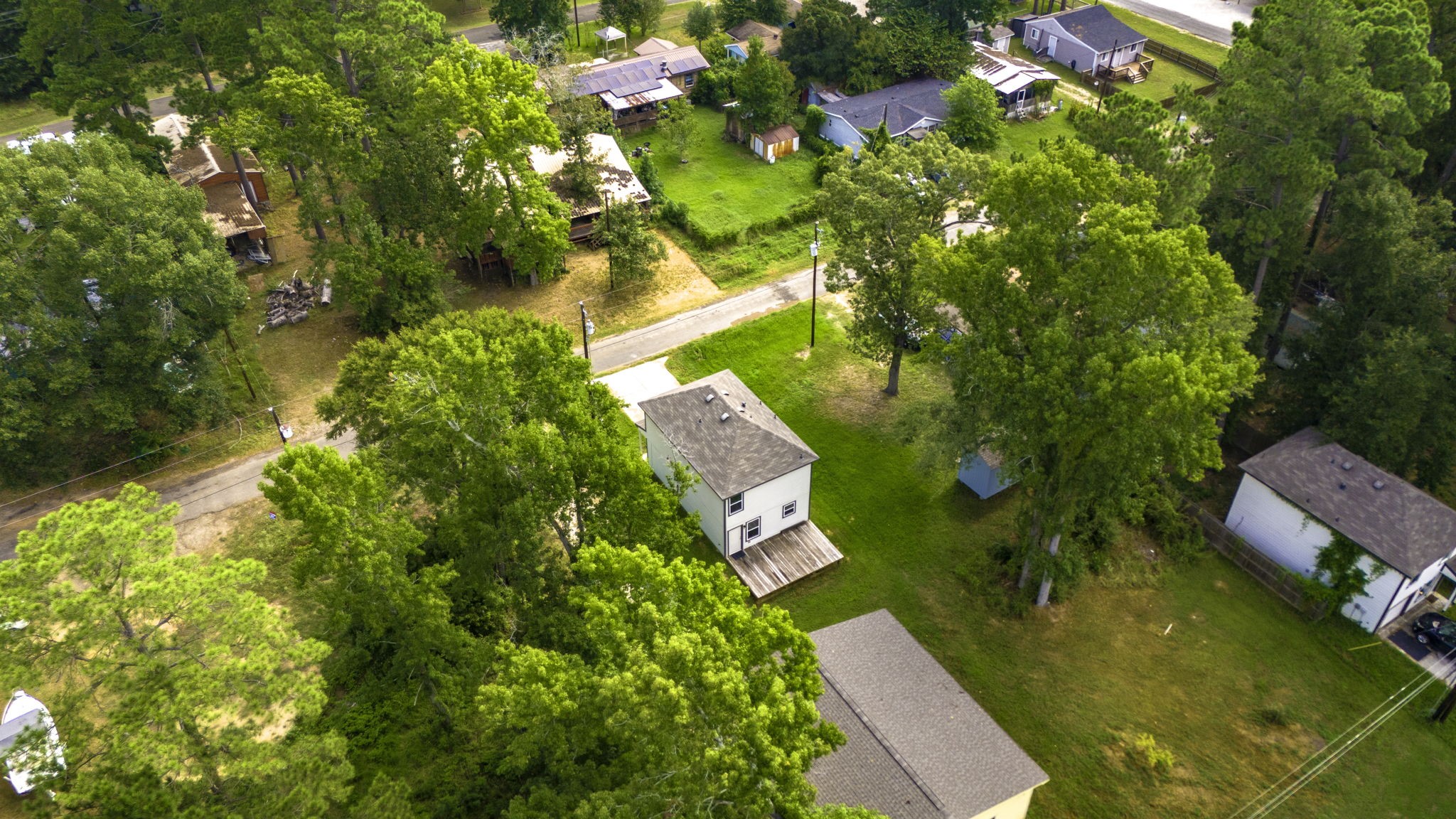 155 Cherry Tree Livingston, TX 77351 - Photo 23 of 30 an aerial view of a house with swimming pool and garden
