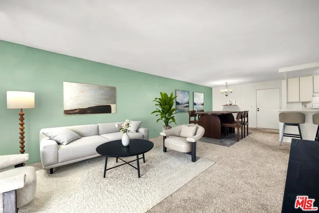 a living room with furniture and a lamp