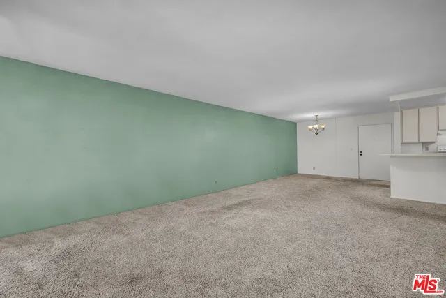 a view of an empty room and entryway