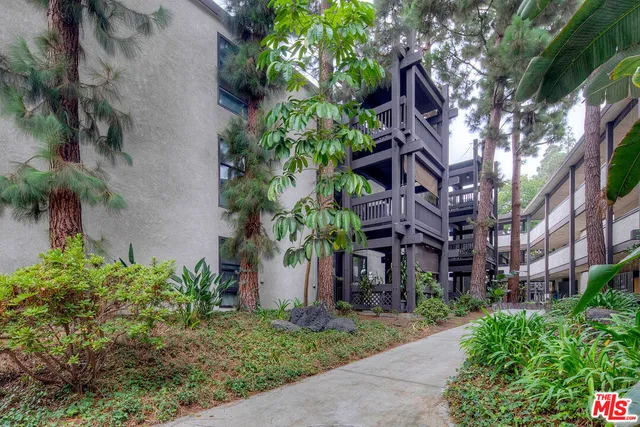 a view of a swimming pool with outdoor seating