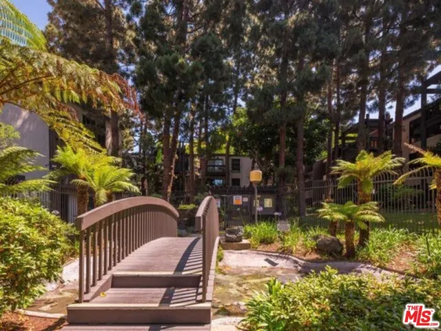 a view of balcony with wooden floor and outdoor seating