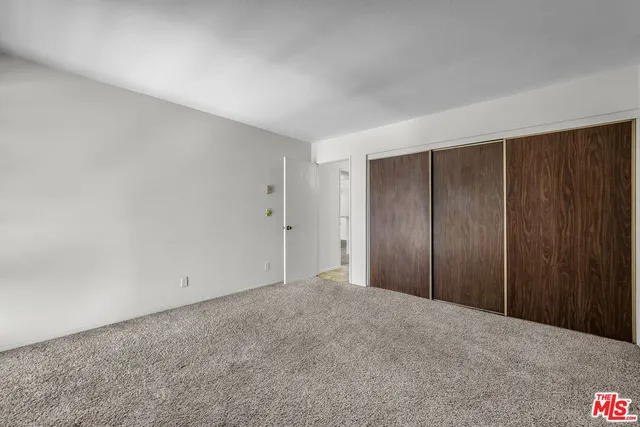 a bathroom with a shower and a toilet