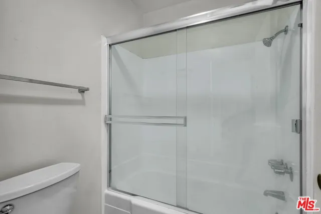 a view of a swimming pool with outdoor seating