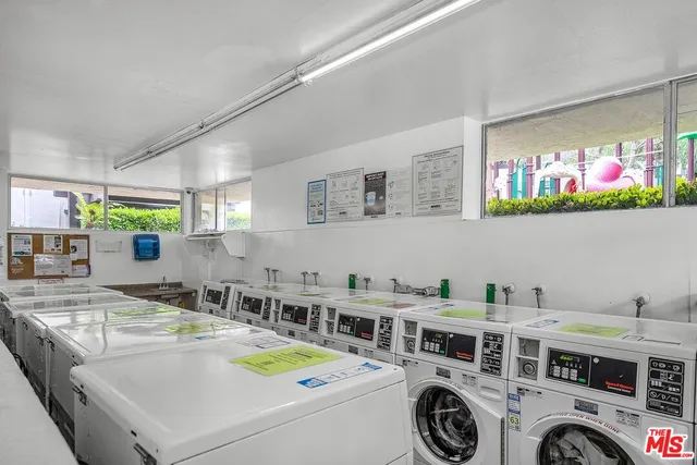 a view of a patio with a table and chairs