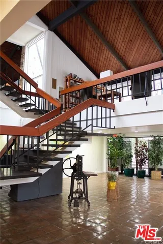 a view of a patio with a table and chairs