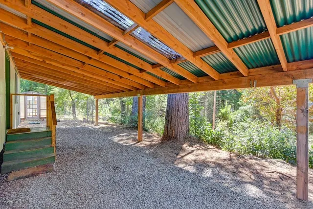 a view of a workspace with furniture and wooden floor