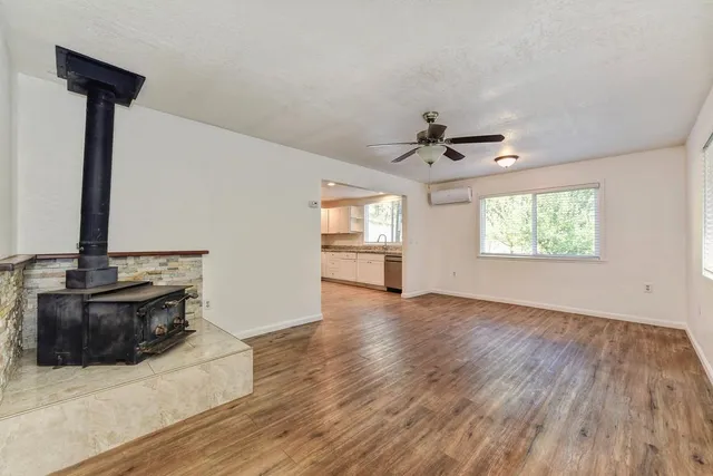 a kitchen with stainless steel appliances a refrigerator and a stove top oven