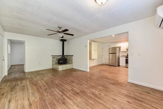 a bathroom with a sink a toilet and tub