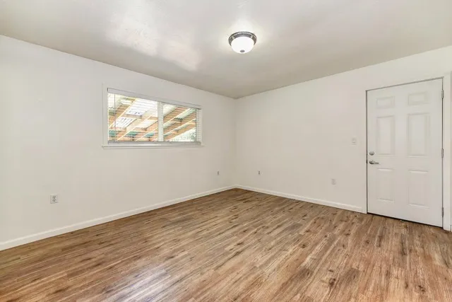 a view of a lush green outdoor space with a lake view