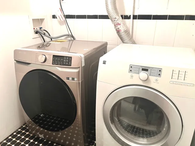 a utility room with dryer and washer