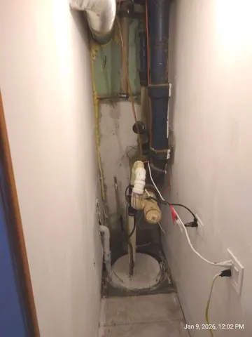 a front view of a house with a road