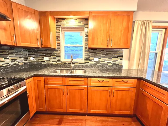 a view of a sink and a window