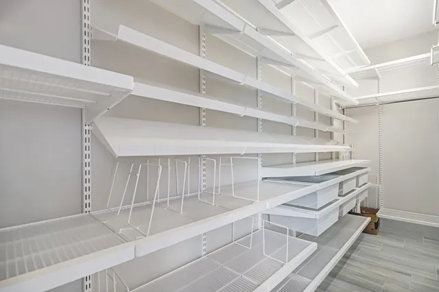 a view of an empty walk in closet