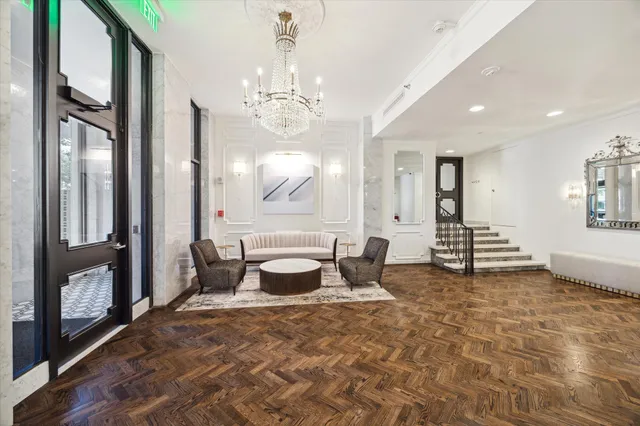 a view of a hallway with furniture