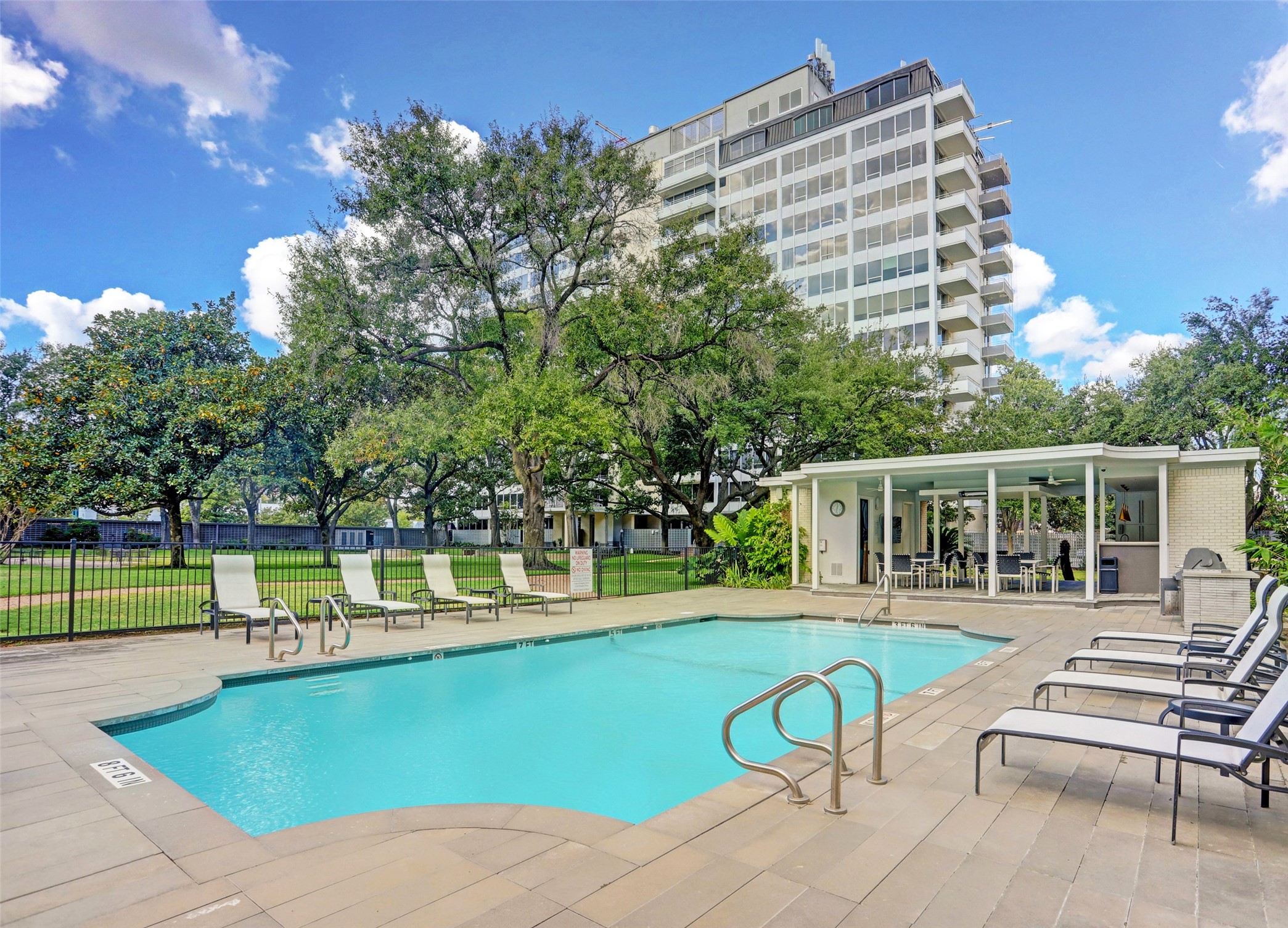 2701 Westheimer Road, Unit 8B Houston, TX 77098 - Photo 25 of 28 swimming pool view with a seating space and a garden view