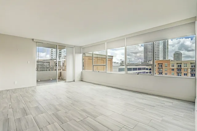 a view of an empty room with a window