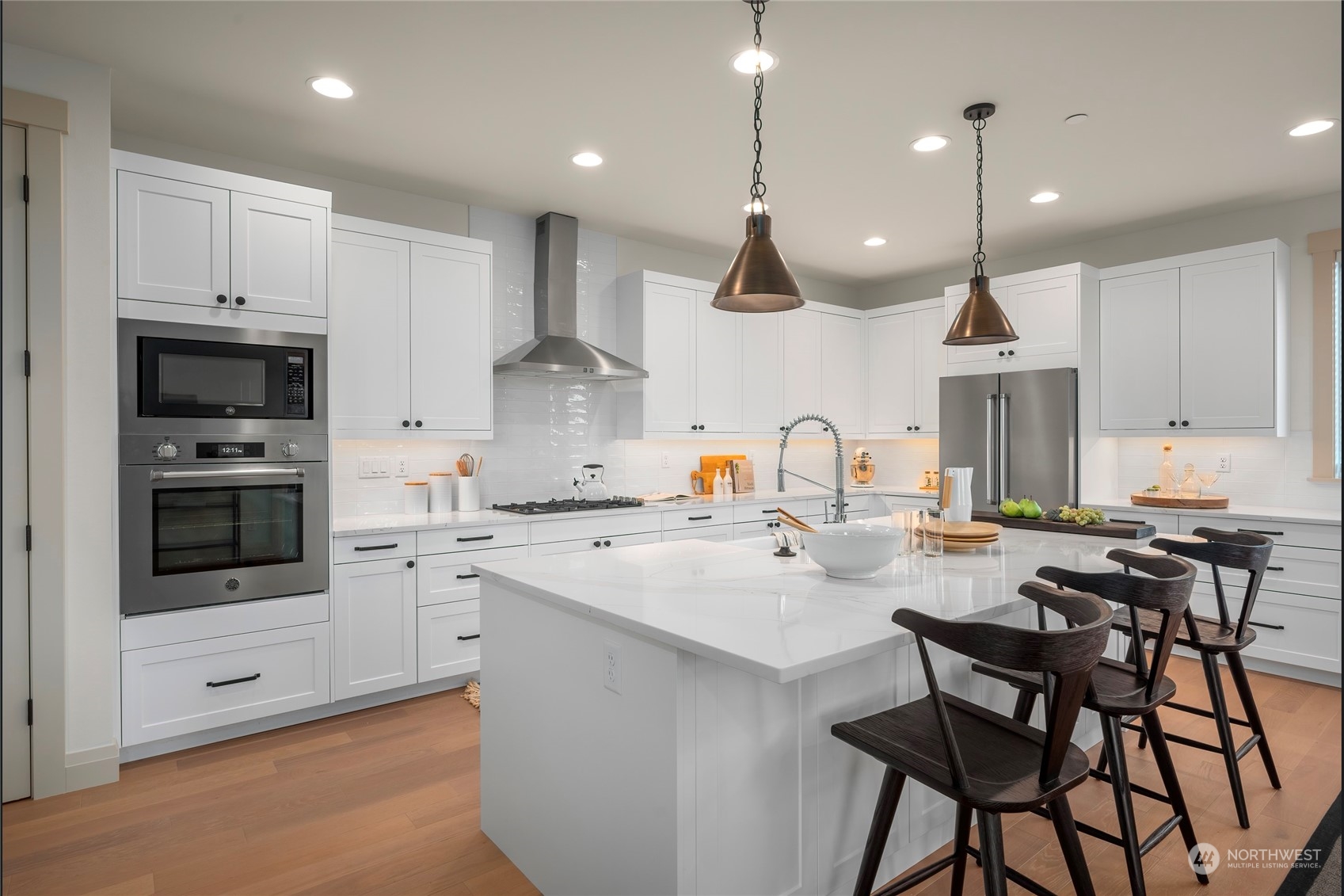324 174th Street Southeast Bothell, WA 98012 - Photo 13 of 37 a kitchen with stainless steel appliances kitchen island granite countertop a sink and cabinets