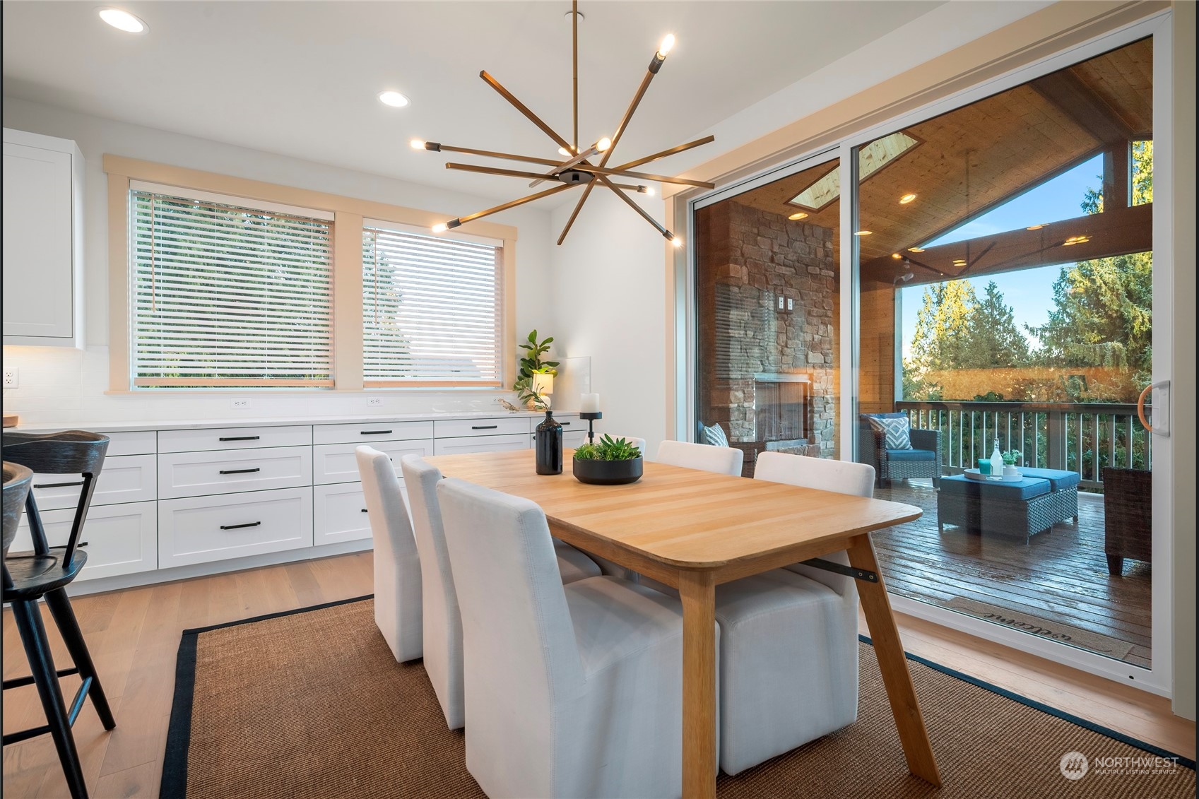 324 174th Street Southeast Bothell, WA 98012 - Photo 17 of 37 a dining room with furniture a large window and a chandelier