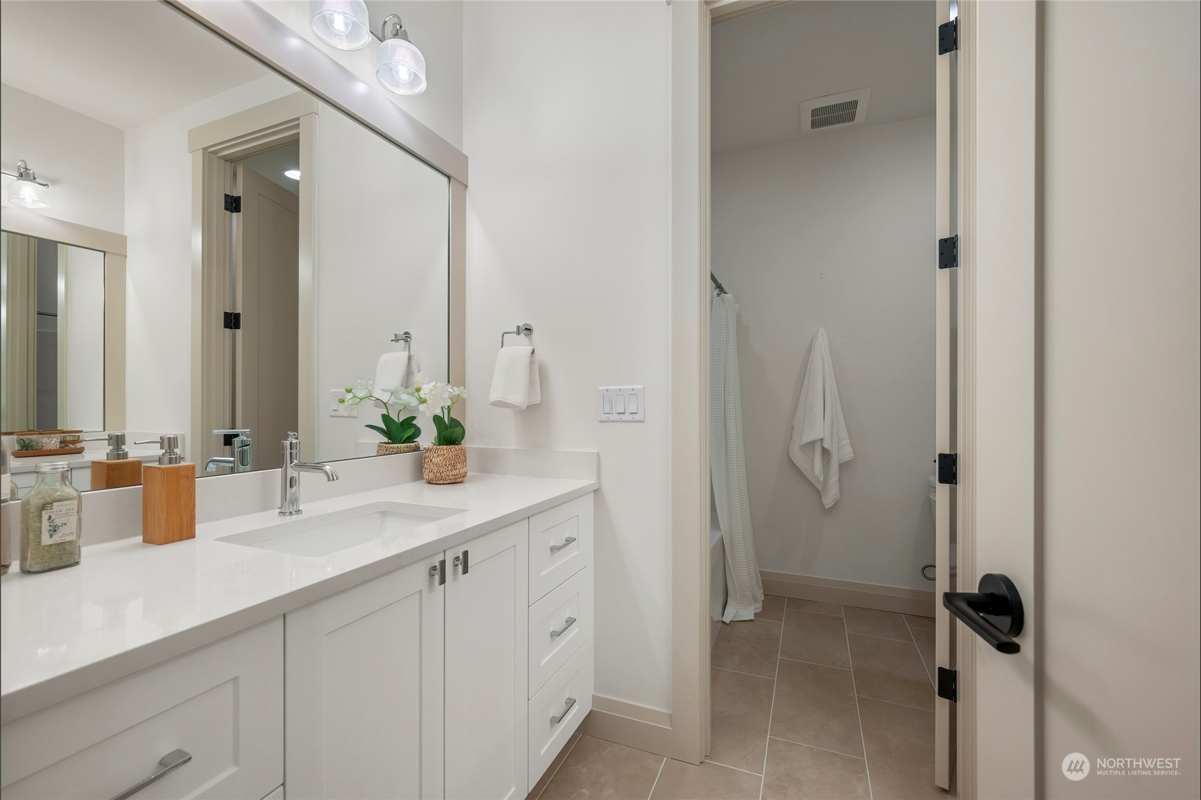 324 174th Street Southeast Bothell, WA 98012 - Photo 22 of 37 a bathroom with a double vanity sink a mirror and shower
