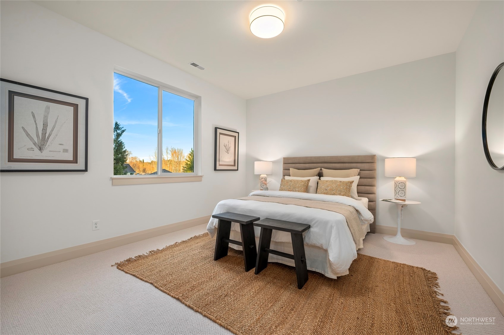 324 174th Street Southeast Bothell, WA 98012 - Photo 23 of 37 a bedroom with a bed and wooden floor