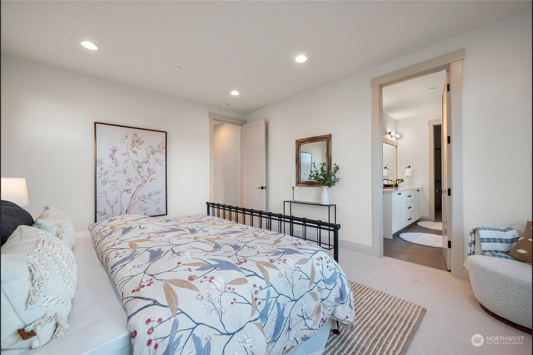 324 174th Street Southeast Bothell, WA 98012 - Photo 26 of 37 a bedroom with a large bed and a chandelier
