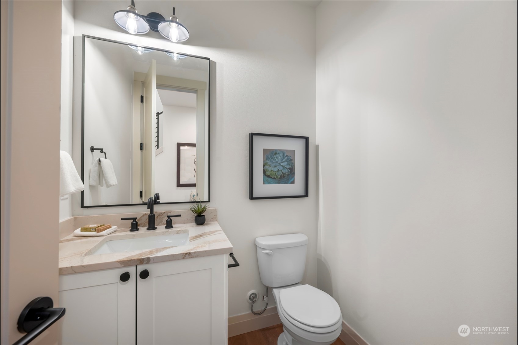324 174th Street Southeast Bothell, WA 98012 - Photo 4 of 37 a bathroom with a granite countertop toilet sink and mirror