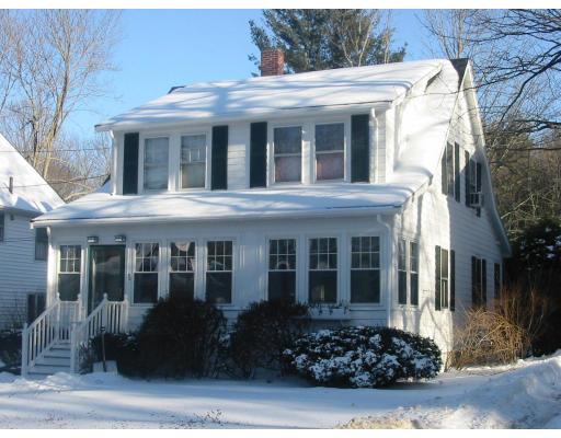 30 Spring Street Lexington, MA 02421 - Photo 1 of 18 a view of a white house with large windows