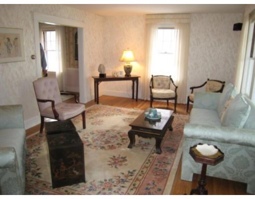 30 Spring Street Lexington, MA 02421 - Photo 11 of 18 a living room with furniture and a lamp