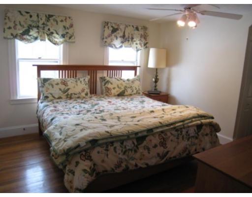 30 Spring Street Lexington, MA 02421 - Photo 12 of 18 a bed sitting in a bedroom next to a window