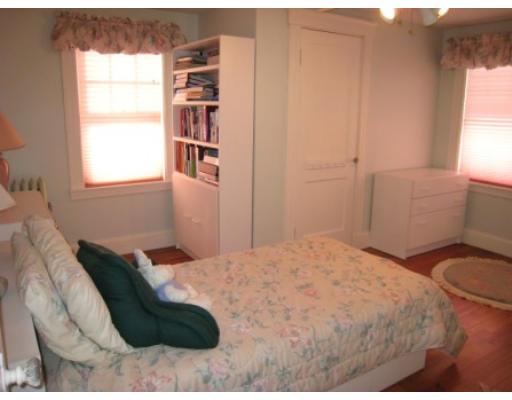 30 Spring Street Lexington, MA 02421 - Photo 13 of 18 a bedroom with a bed and a window