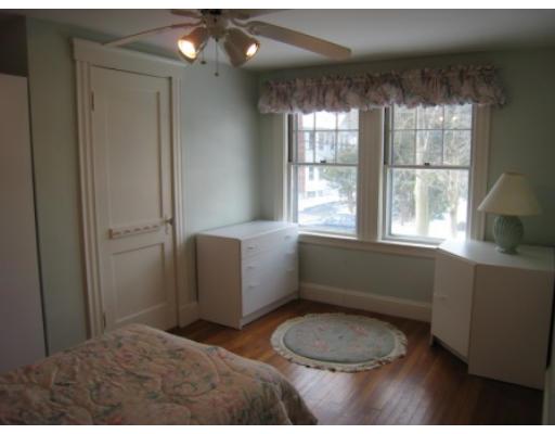 30 Spring Street Lexington, MA 02421 - Photo 14 of 18 a bathroom with a toilet a sink a tub and window