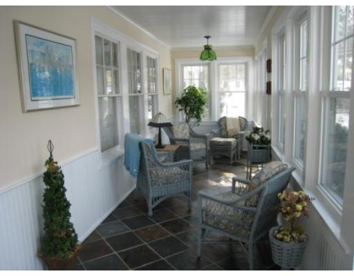 30 Spring Street Lexington, MA 02421 - Photo 2 of 18 a living room with furniture and a potted plant