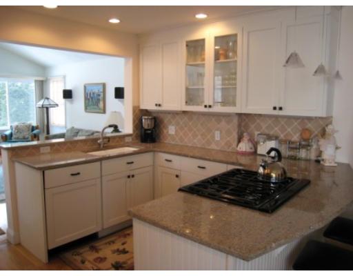 30 Spring Street Lexington, MA 02421 - Photo 4 of 18 a kitchen with sink and cabinets
