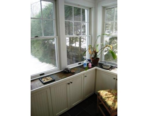 30 Spring Street Lexington, MA 02421 - Photo 8 of 18 a kitchen with a sink and large window