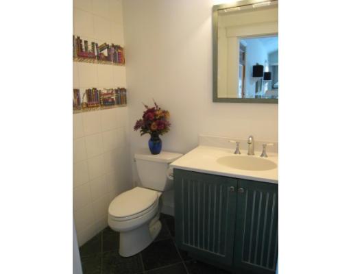 30 Spring Street Lexington, MA 02421 - Photo 9 of 18 a bathroom with a sink toilet and mirror