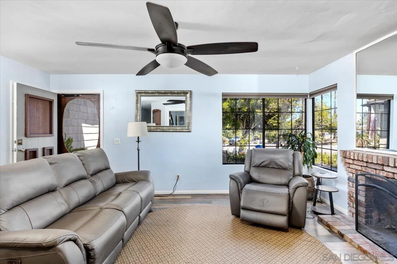 2337 Fallingleaf Road Oceanside, CA 92056 - Photo 15 of 34 a living room with furniture and a fireplace