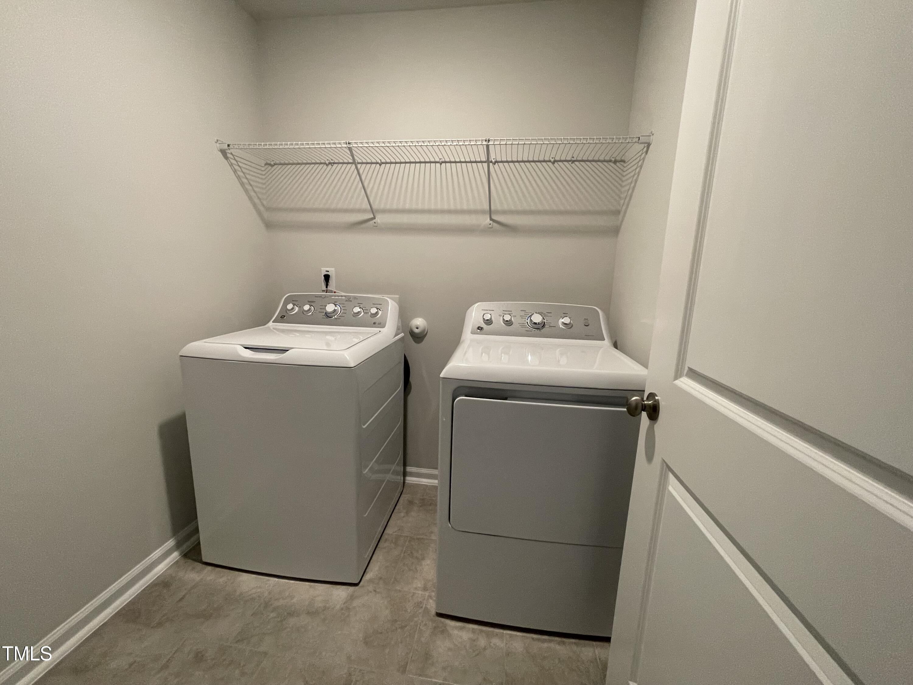 239 Paramount Drive Smithfield, NC 27577 - Photo 12 of 16 a utility room with dryer and washer