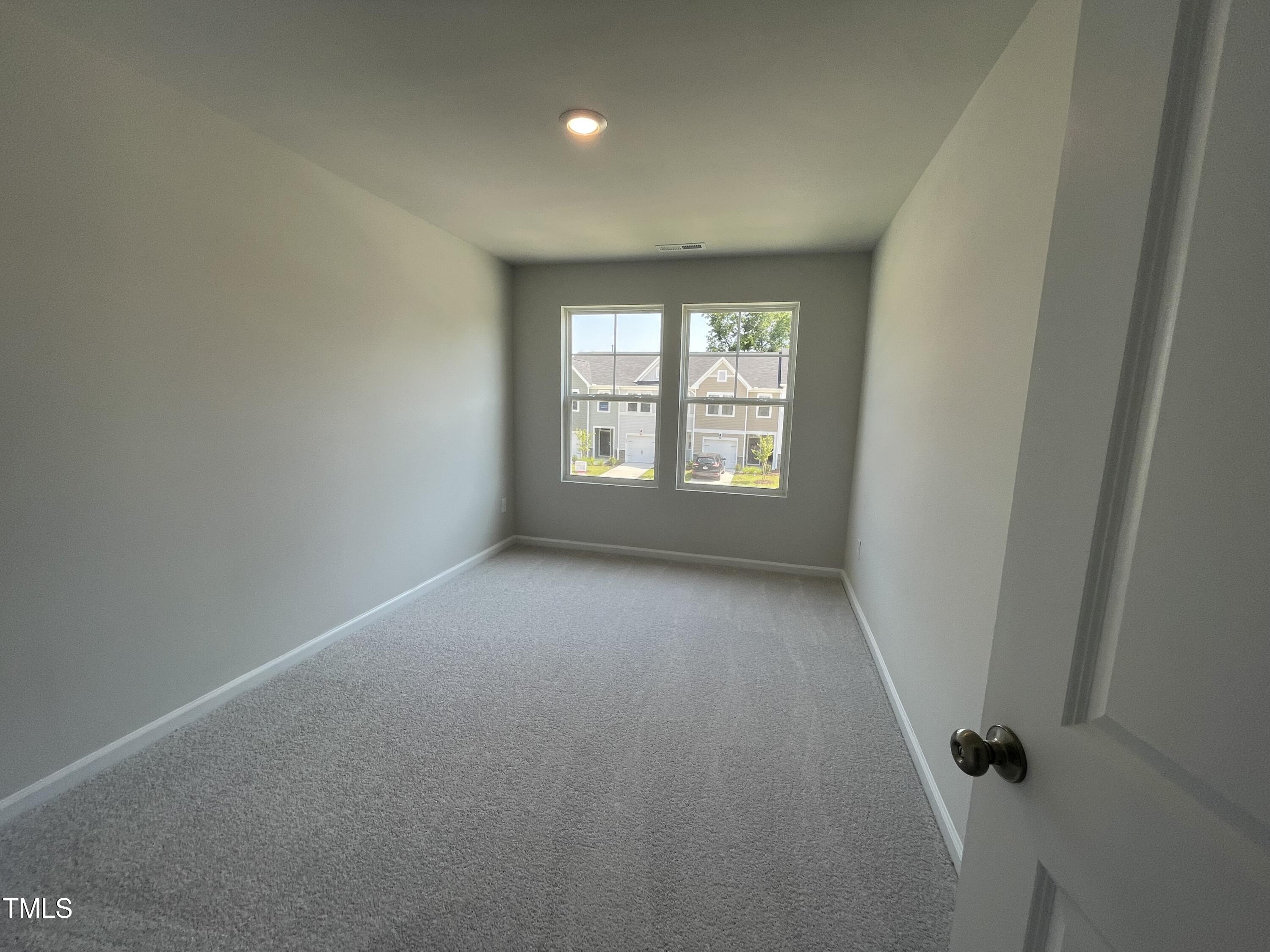 239 Paramount Drive Smithfield, NC 27577 - Photo 10 of 16 an empty room with a window