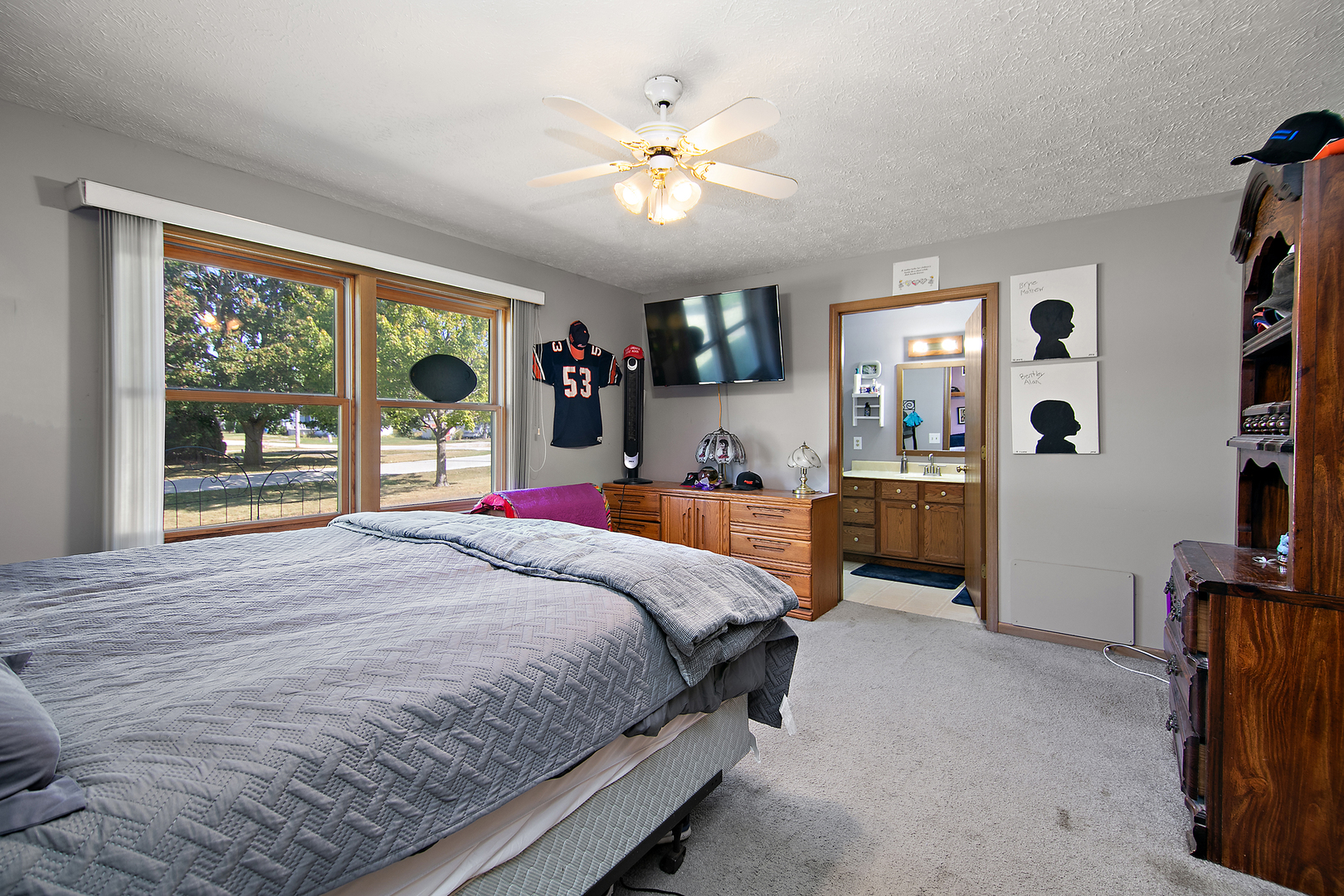 126 East Cleveland Street Cullom, IL 60929 - Photo 12 of 29 a bedroom with a large bed and a large window