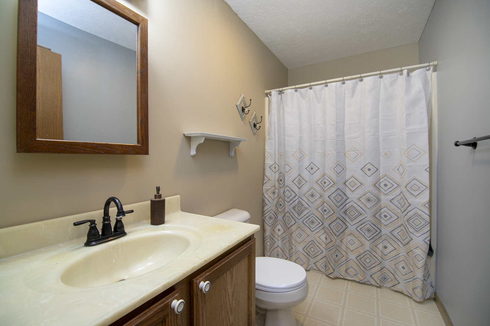 126 East Cleveland Street Cullom, IL 60929 - Photo 15 of 29 a bathroom with a sink and a mirror