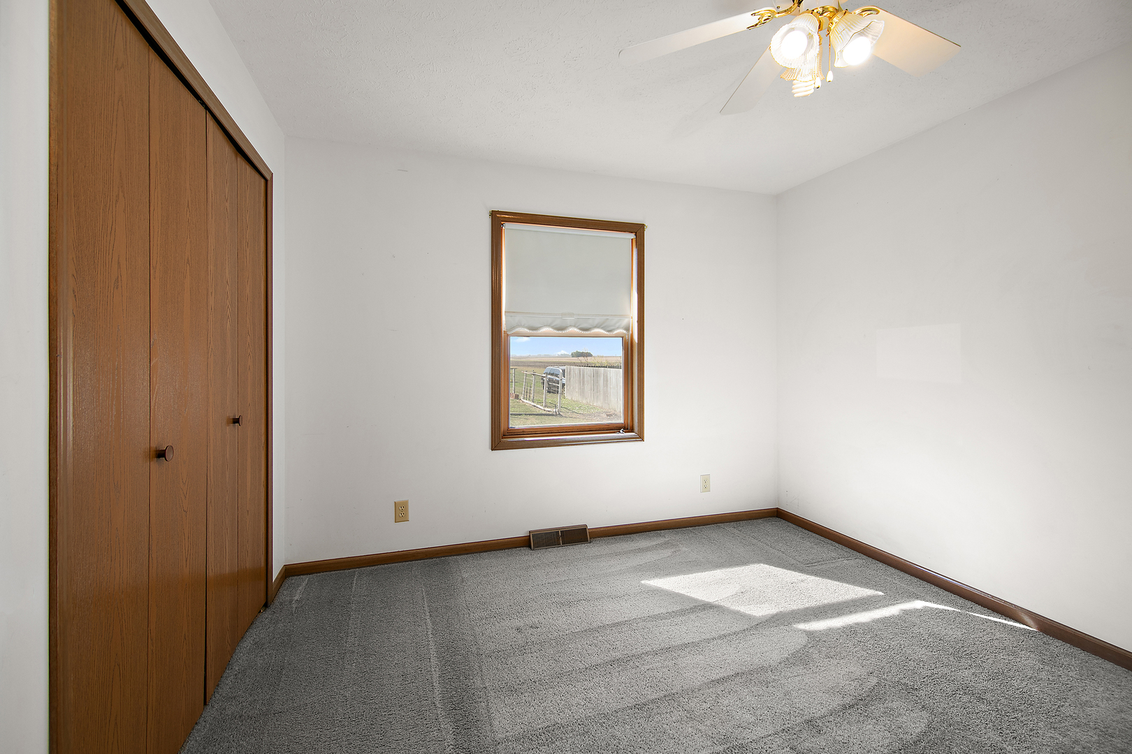 126 East Cleveland Street Cullom, IL 60929 - Photo 19 of 29 an empty room with a window