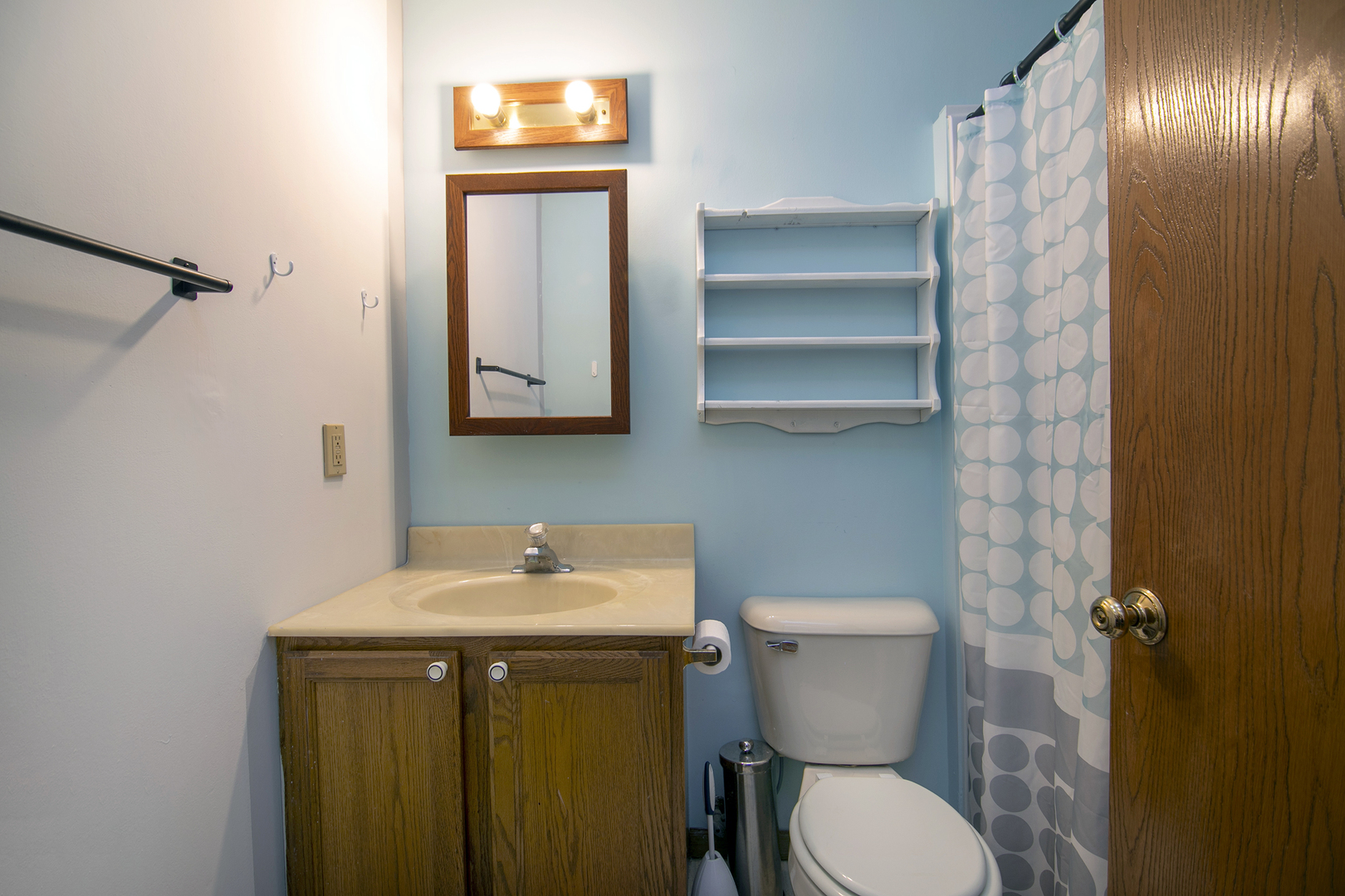 126 East Cleveland Street Cullom, IL 60929 - Photo 20 of 29 a bathroom with a toilet sink and mirror