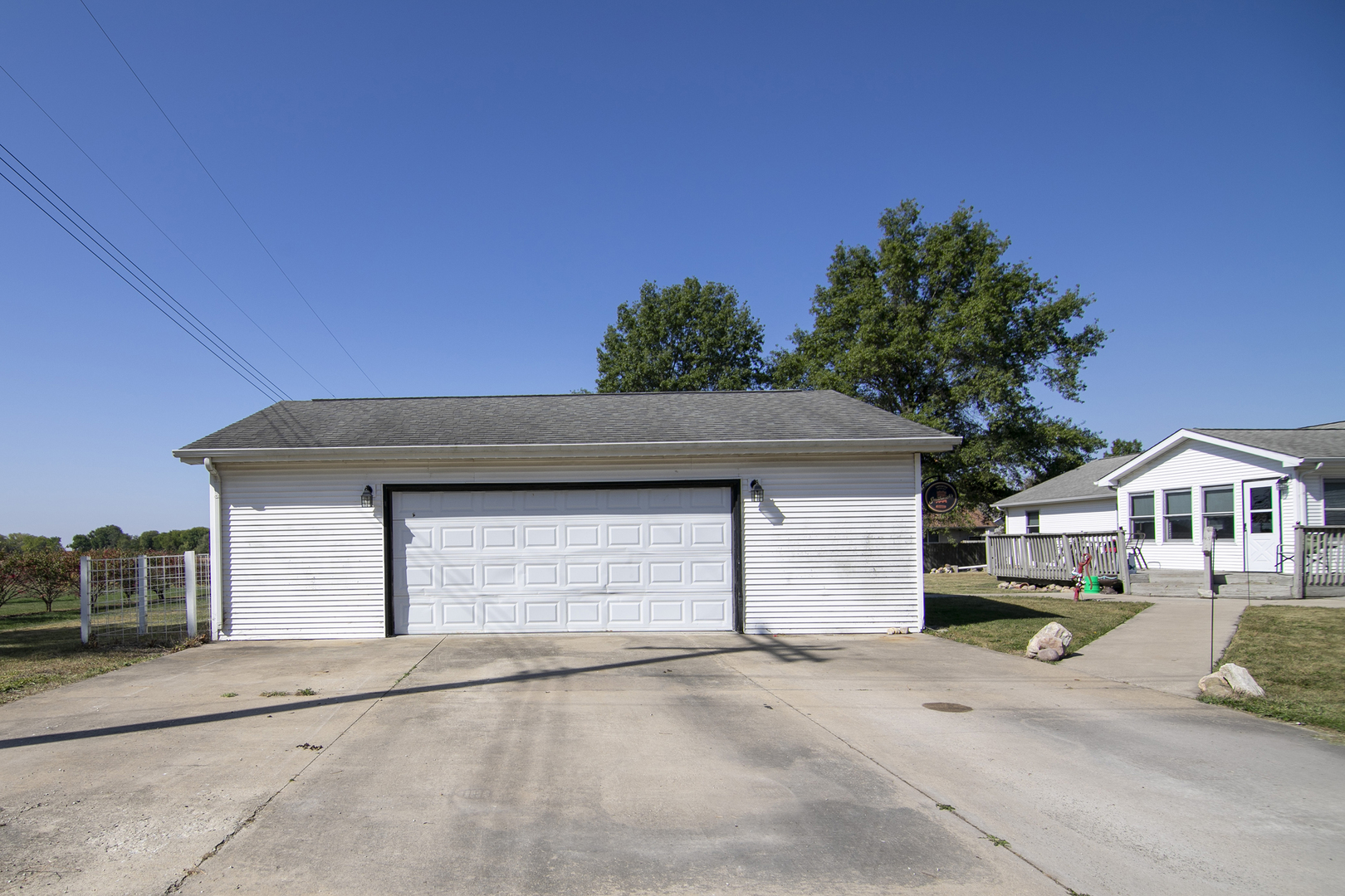126 East Cleveland Street Cullom, IL 60929 - Photo 26 of 29 a front view of a house with a yard and garage