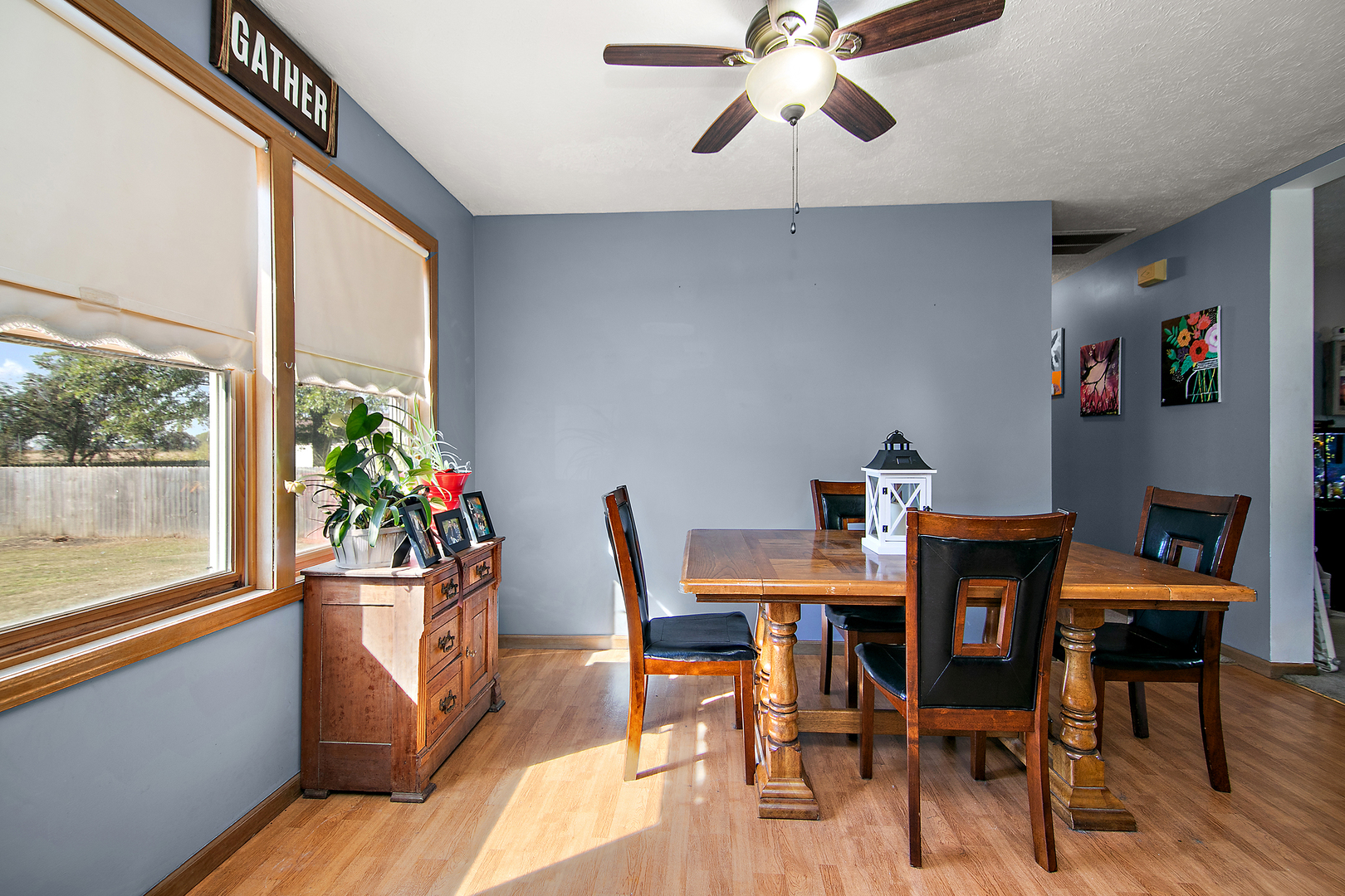 126 East Cleveland Street Cullom, IL 60929 - Photo 5 of 29 a dining room with furniture potted plants and wooden floor