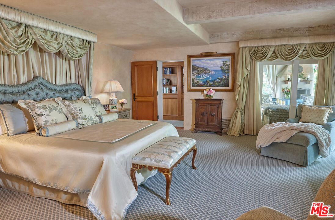 10957 Bellagio Road Los Angeles, CA 90077 - Photo 13 of 18 a bed room with a bed and a couch